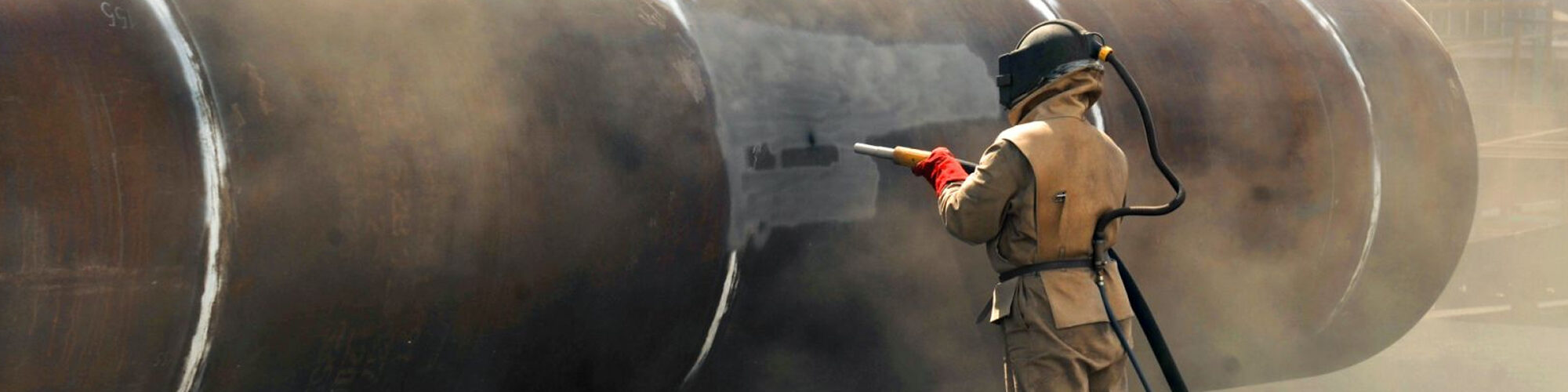 An expert treating a tanks surface