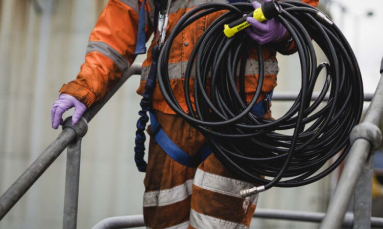 REDS employee carrying equipment