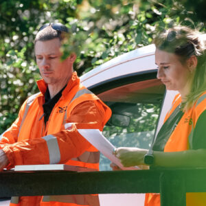 Two REDS employee's assessing a job